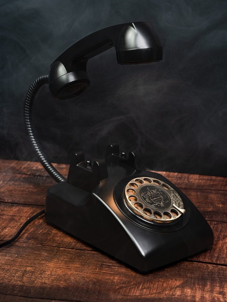 Retro Phone Lamp on wooden desk.