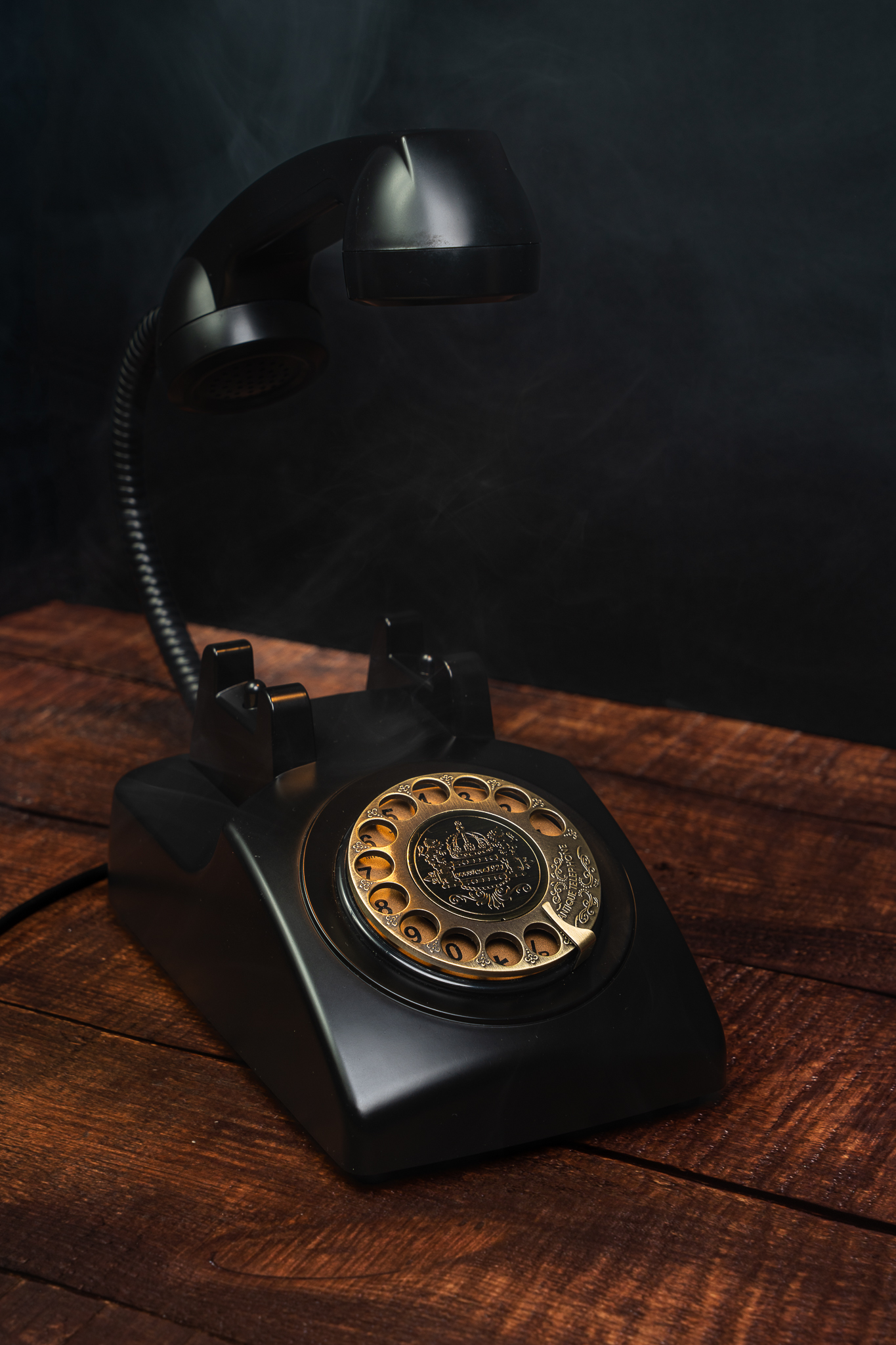 Retro Phone Lamp on a vintage dark wooden desk.