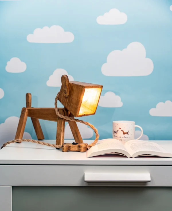 Dog lamp on a white shelf.