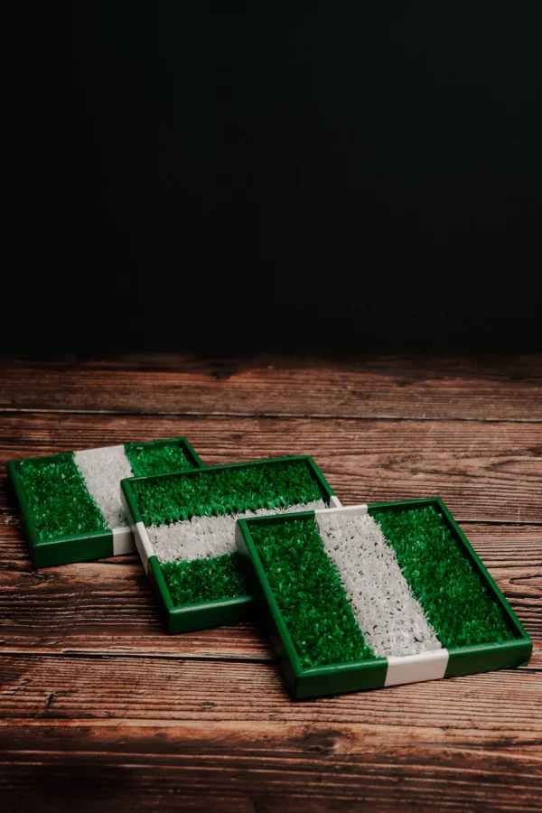 Three football cup coasters with lines.